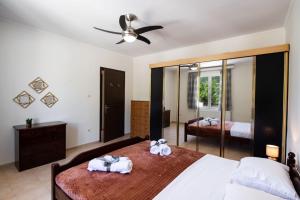A bed or beds in a room at Irinis House
