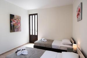 A bed or beds in a room at Irinis House