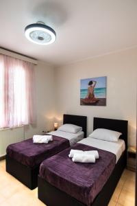 A bed or beds in a room at Irinis House