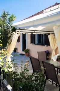 A patio or other outdoor area at Irinis House