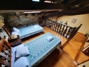 A bed or beds in a room at Casa Viduedo