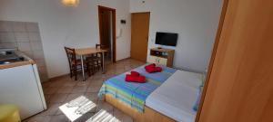 Posteľ alebo postele v izbe v ubytovaní Apartments Dada