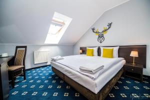Posteľ alebo postele v izbe v ubytovaní Karpacki & SPA - blisko wyciągu, Restauracja, Sala Zabaw, Bar 24h