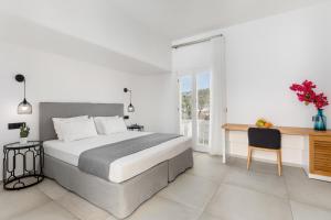 Cama ou camas em um quarto em Corfos Hotel