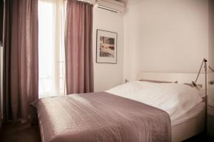 Кровать или кровати в номере AnaZa Appartement