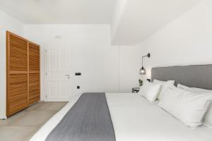 Cama ou camas em um quarto em Corfos Hotel