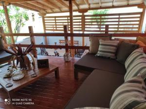 a living room with a couch and a coffee table at Kastalia in Ammouliani