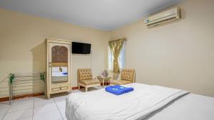 Posteľ alebo postele v izbe v ubytovaní Hotel Cempaka Sari