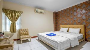 Posteľ alebo postele v izbe v ubytovaní Hotel Cempaka Sari