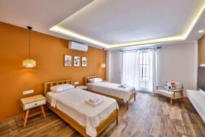 Postel nebo postele na pokoji v ubytování Yaz Apart Hotel