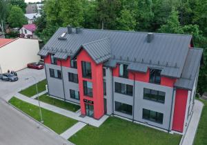 an aerial view of a house with red at Tip Tap Guest House in Druskininkai