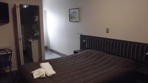 Postel nebo postele na pokoji v ubytování Motel on Carroll