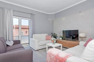 TV a/nebo společenská místnost v ubytování Apartments Gisela