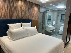 Ένα ή περισσότερα κρεβάτια σε δωμάτιο στο Nare Boutique Hotel