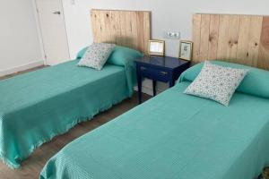 Säng eller sängar i ett rum på Apartamento nuevo, céntrico y tranquilo