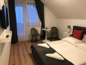 Postel nebo postele na pokoji v ubytování Tóranéző Ház