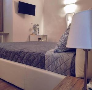Postel nebo postele na pokoji v ubytování B&B Piano Romano -con parcheggio privato gratuito-