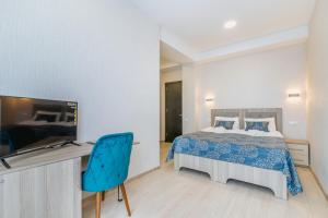 Uma cama ou camas num quarto em Vita Gardenia Hotel Tskaltubo