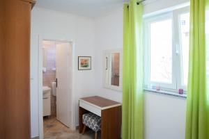 Postel nebo postele na pokoji v ubytování Apartmani Vrtodusic
