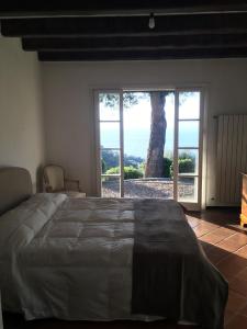 Ένα ή περισσότερα κρεβάτια σε δωμάτιο στο Villa della Pietra