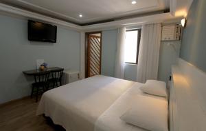 Cama ou camas em um quarto em Gran Chevalier Hotel
