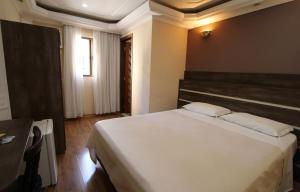 Cama ou camas em um quarto em Gran Chevalier Hotel