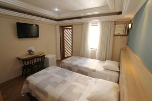 Cama ou camas em um quarto em Gran Chevalier Hotel
