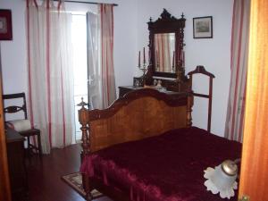 Un pat sau paturi într-o cameră la Casa da Moagem - Serra do Açor