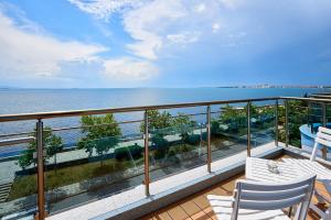 a balcony with a view of the water at Neptun in Pomorie