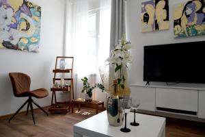 TV i/ili multimedijalni sistem u objektu Apartment Krins