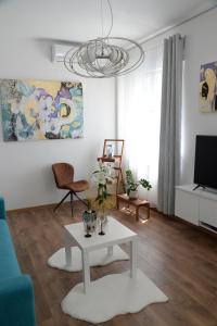 TV i/ili multimedijalni sistem u objektu Apartment Krins