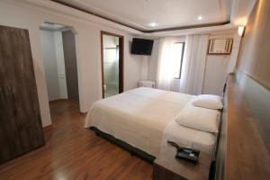 Cama ou camas em um quarto em Gran Chevalier Hotel