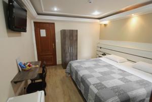Cama ou camas em um quarto em Gran Chevalier Hotel