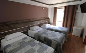 Cama ou camas em um quarto em Gran Chevalier Hotel