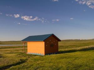 a smallshed in the middle of a field at Lodgepole Gallery in Browning