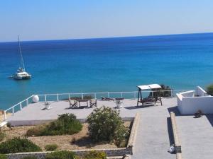 a view of the ocean with a boat in the water at Maistrali in Provatas