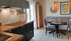 a kitchen with a table and a dining room at Apartment for Two 200m from the Beach in Pula