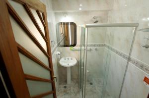 Um banheiro em Gran Chevalier Hotel