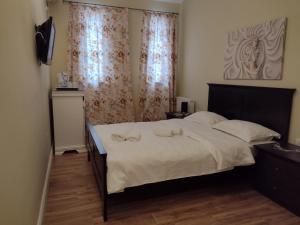 Postel nebo postele na pokoji v ubytování Adrys Boutique Villa