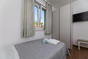 Postel nebo postele na pokoji v ubytování Apartment Nada 1
