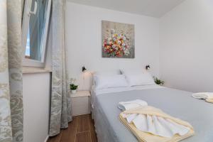 Postel nebo postele na pokoji v ubytování Apartment Nada 1