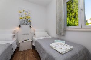 Postel nebo postele na pokoji v ubytování Apartment Nada 1