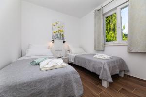 Postel nebo postele na pokoji v ubytování Apartment Nada 1