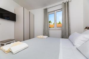 Postel nebo postele na pokoji v ubytování Apartment Nada 1