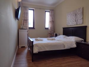 Postel nebo postele na pokoji v ubytování Adrys Boutique Villa