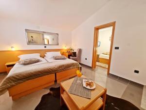 Posteľ alebo postele v izbe v ubytovaní Hotel Sunce