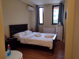 Postel nebo postele na pokoji v ubytování Adrys Boutique Villa