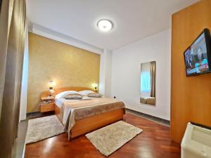 Posteľ alebo postele v izbe v ubytovaní Hotel Sunce