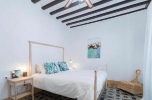 A bed or beds in a room at APARTAMENTO LA MODERNA