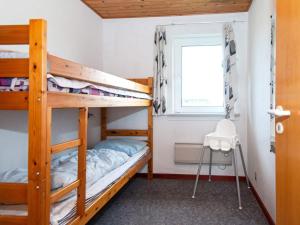 a bunk bed room with two bunk beds and a window at 10 person holiday home in Harboøre-By Traum in Harboør +37 photos